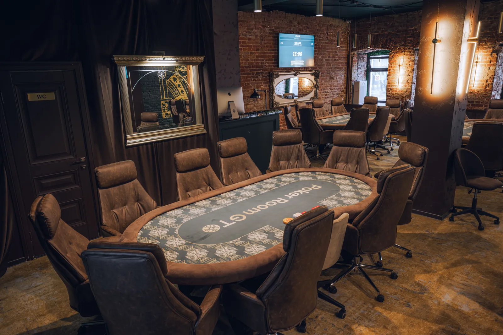 Tournament table by the windows in the poker club hall