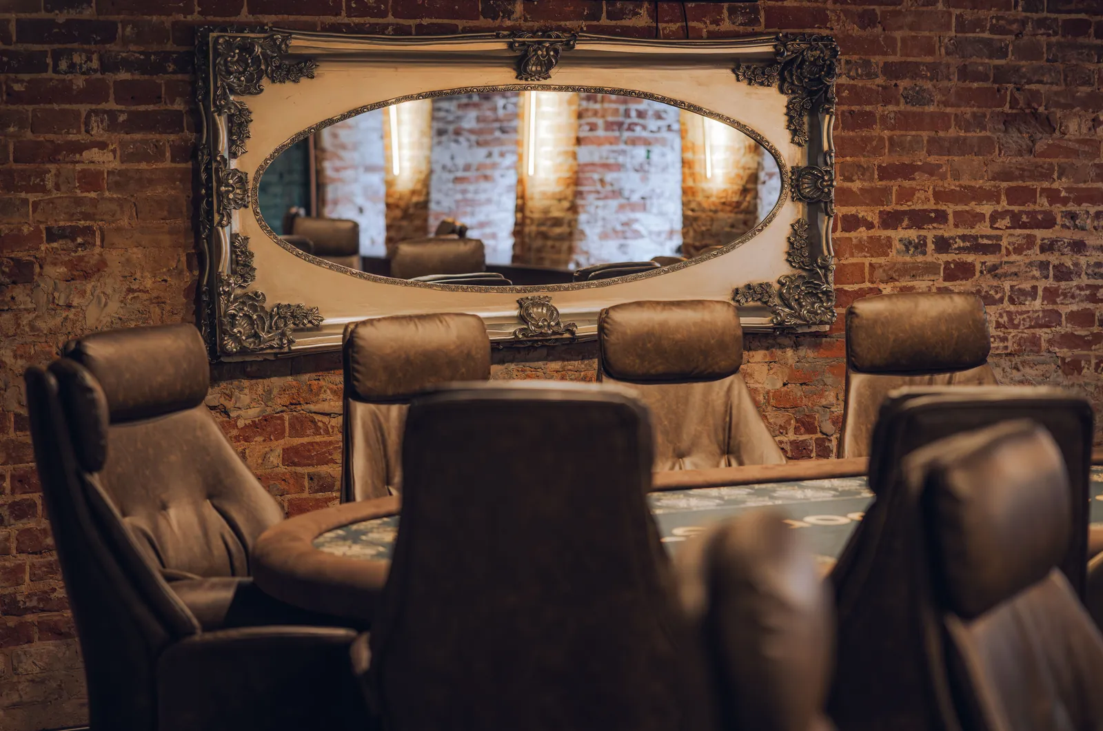 Lounge area with leather armchairs in the club interior
